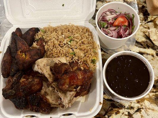 1/2 White Meat with fried rice, Fried sweet Plantains, Black Beans, and onion Onion & Tomato Salad