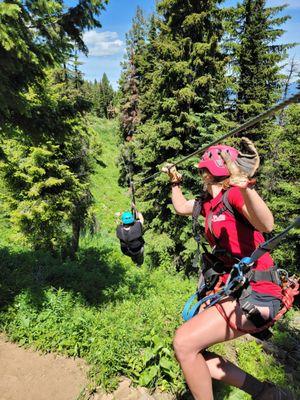 Me on the first of 8 ziplines and Kira encouraging me as I take that first zip!