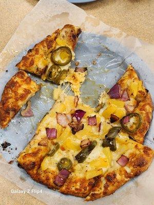 Mouth before camera this time- soon good! Jalapeño pineapple specialty treat pizza- great kick from pepper