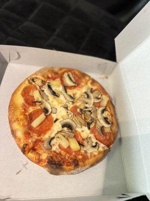 Mini size pizza with pepperoni, mushroom, and pineapple