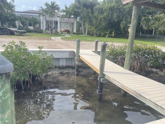 Vinyl Seawall w/ 20"X24" concrete cap and dock