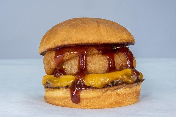 The Onion Burger impossible patty, cheddar cheese, onion rings, bbq sauce