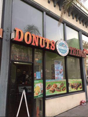 Crossaint breakfast sandwich and donut with sprinkles