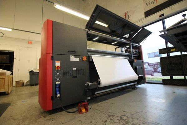 Our newest machine in the shop. This flatbed printer can print on nearly any surface up to 5 feet wide and infinitely long.