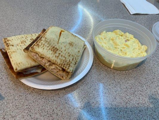 Turkey, swiss, and honey mustard sandwich and a side of deviled egg potato salad