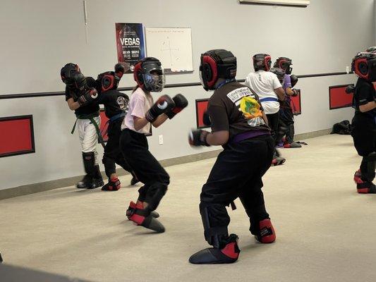 Sparing every Thursday with the advanced kids class. They learn self control and how to fight.