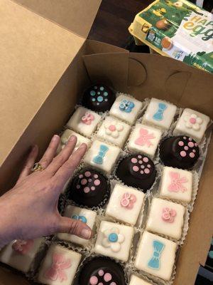 Petit fours with hand for size reference