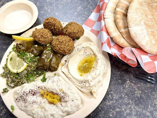 Veg platter - hummus, baba ghanoush, tabouli salad, Dalmas, falafel... and pita bread.