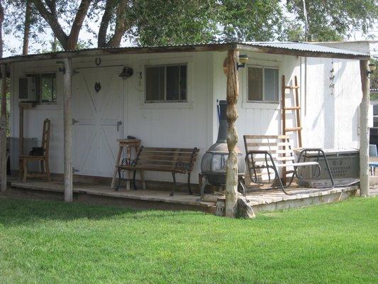 Bunk House for clients with hot & cold running water, 2 refrigerators, a microwave and plenty of benches to just sit and relax on the porch.