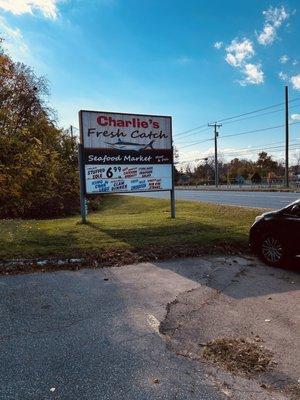 Charlie's Fresh Catch and Seafood Market sign. Visible from the main road.