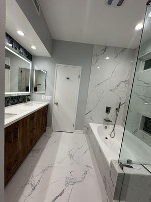 Boston double vanity cognac wood color, white quartz countertop, brush nickel finishes, Carrara white tile, floor matte and walls gloss.