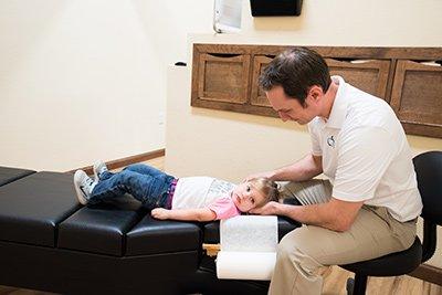 Dr. Aaron Patchen adjusting a patient