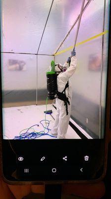 Hepa vacuuming inside a containment.