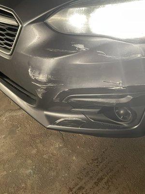 Initial front bumper damage