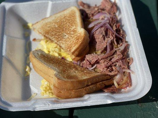 White toast with scrambled eggs and Corned Beef Hash