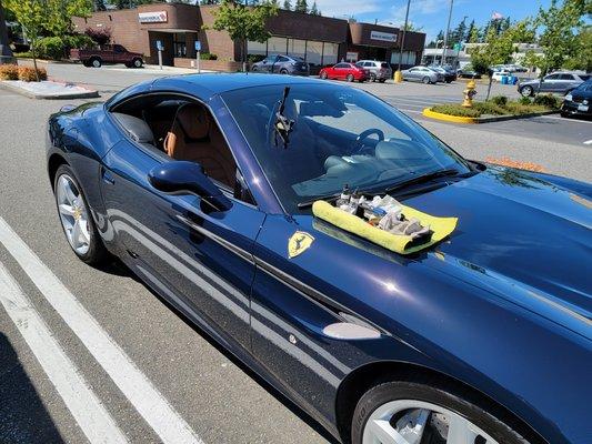 Repairing a rock chip on a Ferrari