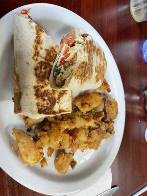 Fajita egg burrito with Swiss cheese and a side of home fries