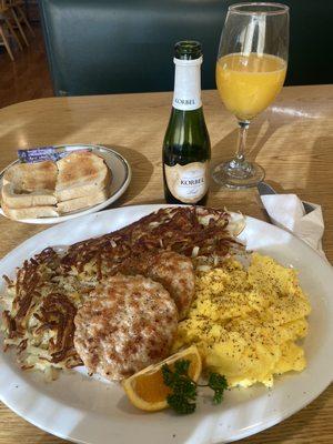 Two egg breakfast with sausage and a side of hash browns!