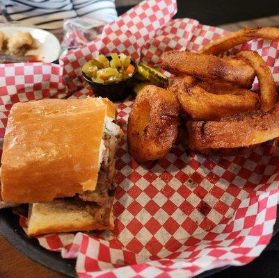 French dip sandwich with onion rings