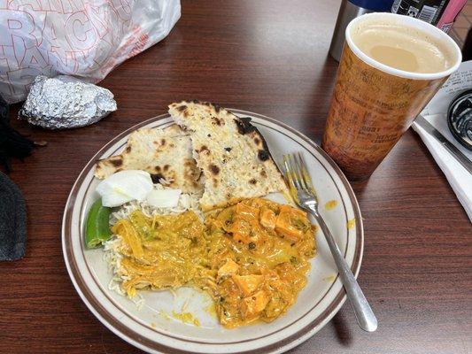 Chicken tikka masala (left), paneer korma (right), over garlic & butter naan, with masala chai.