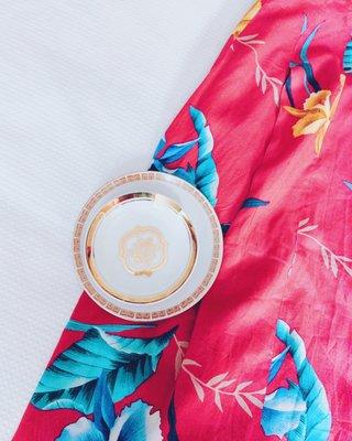 Cute vintage Japanese skirt, vintage dish with a neat eye pattern, a gold trinket dish - seemingly 'borrowed' from a fancy hotel.