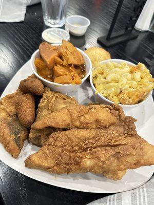 Fish and wings with mac, sweet potatoes, and hush puppies.