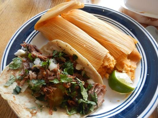 Carnitas taco and a couple of pork tamales (takeout.) Yummay.