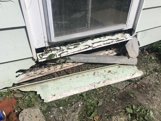 This is the broken vinyl siding the shingle hit when he tossed the pack off the roof and didn't tell me.