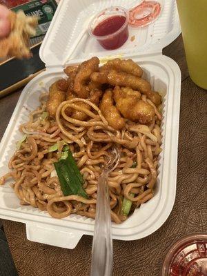 Lemon chicken/chowmein plate with some eaten egg roll. Lol