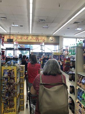 Two lanes open. Neither moving. 7 people in line for the 15 items or less and in 10 minutes nobody has moved. Grr.