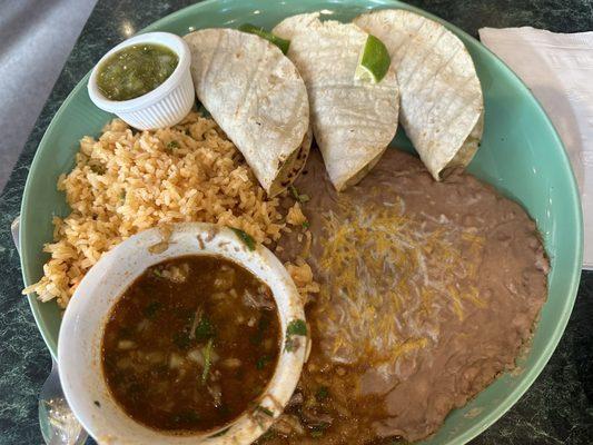 Lamb tacos with refried beans and Mexican rice