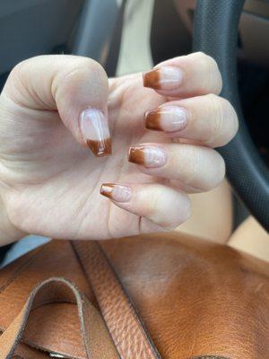 See through brown and super thick nails.