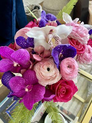 Bouquet of ranunculus, roses, orchids and lilies