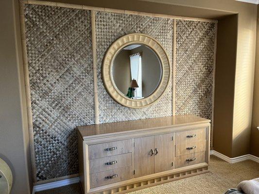 Barn door matching the grass cloth installation in the same bedroom