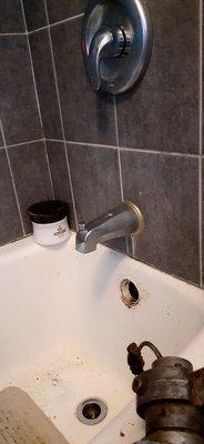 unclogging a bathtub drain.