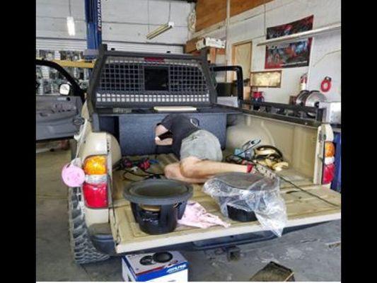 Shawn installing Alpine subs in a Custom Box, that is ported into the cab