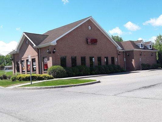 The drive-thru is on the far left. Spacious parking lot.