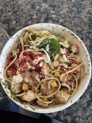 This looks like Spaghetti, Basil Pesto, Spinach, Corn, Red Peppers and who knows what else.