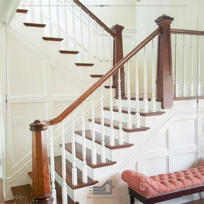 staircase with wainscot paneling