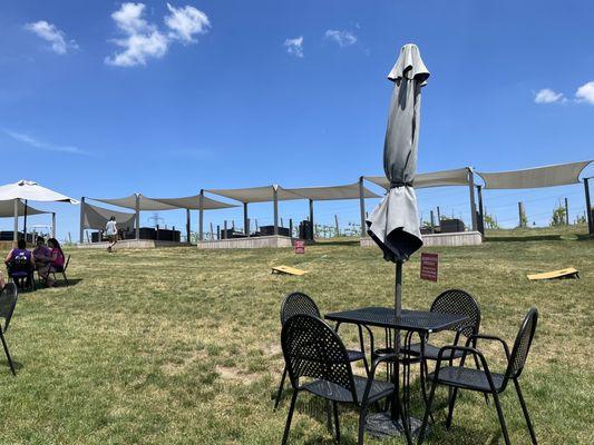 Cabana seating area by the vineyard and table seating