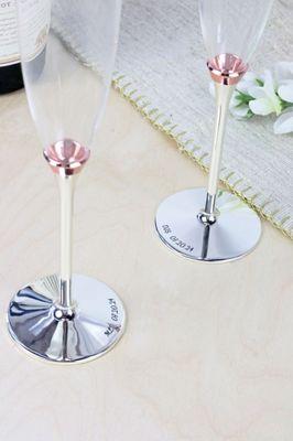 Custom engraved champagne glasses with a wedding date--perfect keepsake for newlyweds to toast their special day!