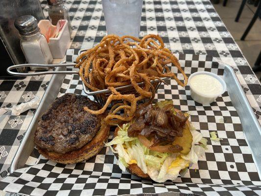 Brisket Burger with shoestring onion rings.