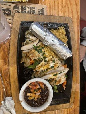 fajita chicken and rice with a side of beans and tortillas very delicious