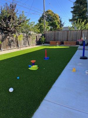 Artificial turf concrete vegetable beds fruit trees and cal gold pebble San Carlos ca