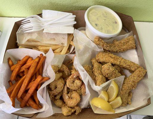 Combo 1 with red snapper fish, shrimp, potato salad, French fries, and sweet potato fries.