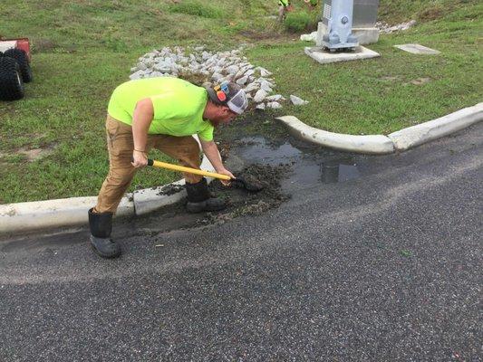 Removing sediment from stormwater asset.