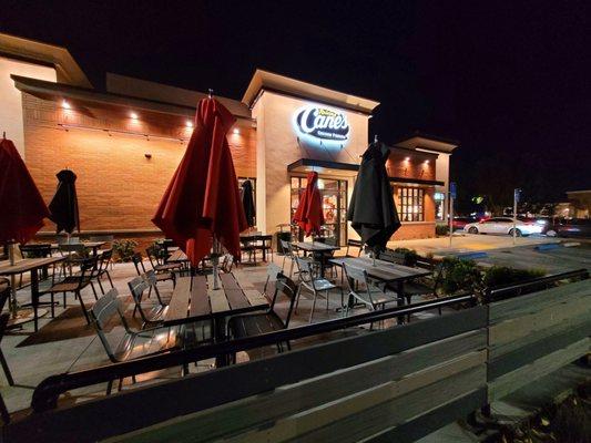 Night time view shows outdoor seating as well.