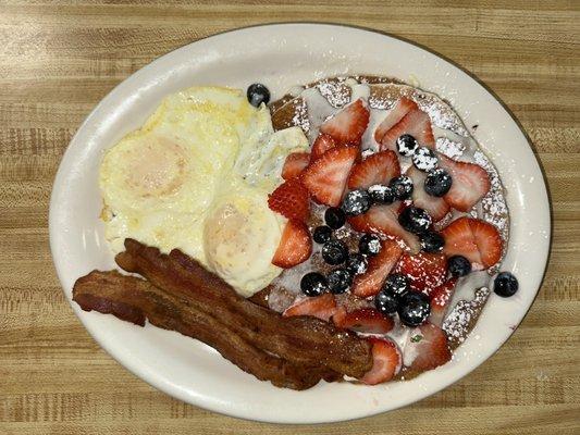 Pancake with strawberry,blueberry bacon & Eggs