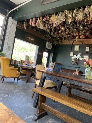 Beautiful seating area with dried flower ceiling decor