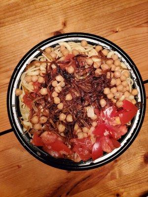 Koshary - spaghetti, macaroni, angel hair pasta, rice, lentils, chickpeas, and fried onions and spicy tomato sauce